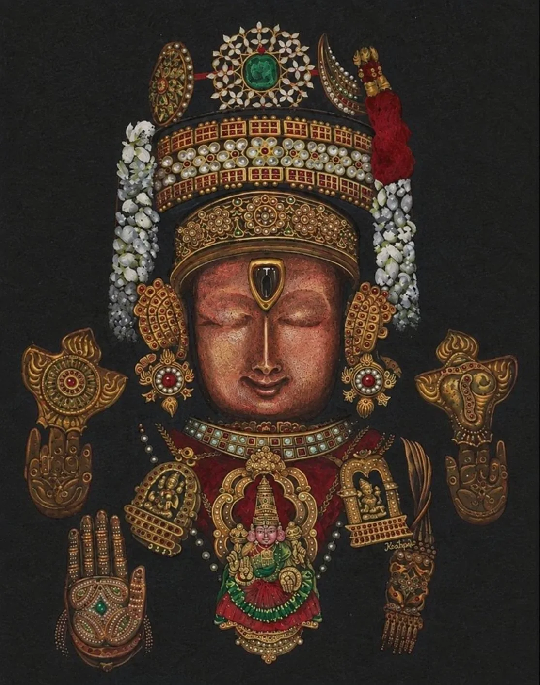 Ornate golden deity adorned with jewels